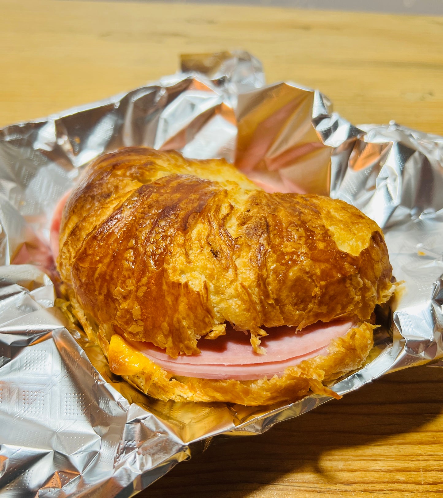 This is an image of a Ham, American cheese, mango salsa, and croissant sandwich. Delicious sandwiches made here at Manga Coffee House. Santa Fe, New Mexico