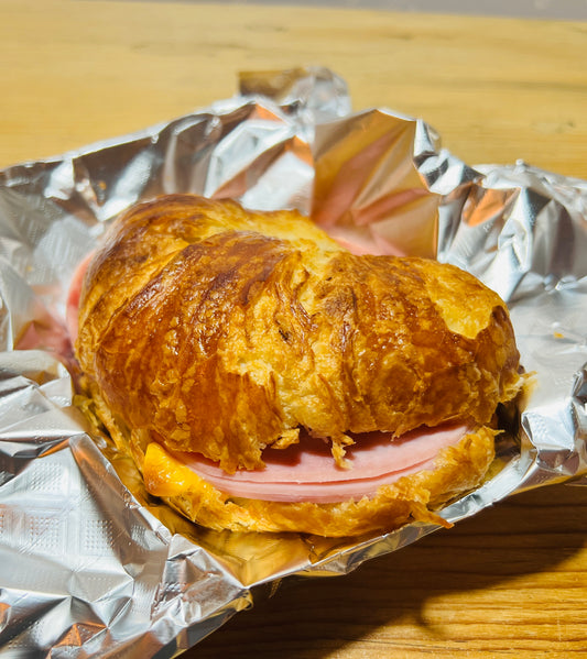 This is an image of a Ham, American cheese, mango salsa, and croissant sandwich. Delicious sandwiches made here at Manga Coffee House. Santa Fe, New Mexico 